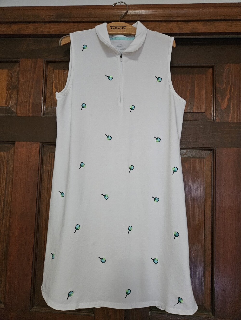Sleeveless White Shift Dress with Green Embroidered Motifs